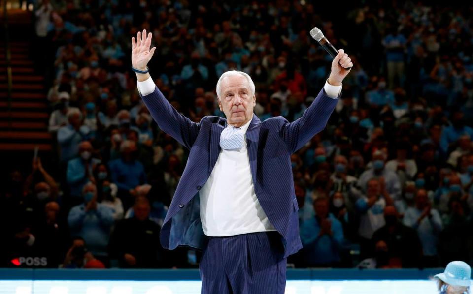 Roy Williams acknowledges the crowd after a halftime ceremony during UNC’s game against N.C. State at the Smith Center in Chapel Hill, N.C., Saturday, Jan. 29, 2022.