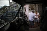 <p>Luis Menendez, a mail man for the U.S. Postal Service, delivers mail at an area affected by Hurricane Maria in the island of Vieques, Puerto Rico, Oct. 7, 2017. (Photo: Carlos Barria/Reuters) </p>