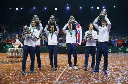Tennis - Belgium v Great Britain - Davis Cup Final - Flanders Expo, Ghent, Belgium - 29/11/15. Men's Singles - Great Britain's Jamie Murray, James Ward, Kyle Edmund, Andy Murray and captain Leon Smith celebrate with the trophy after winning the Davis Cup. Action Images via Reuters / Jason Cairnduff