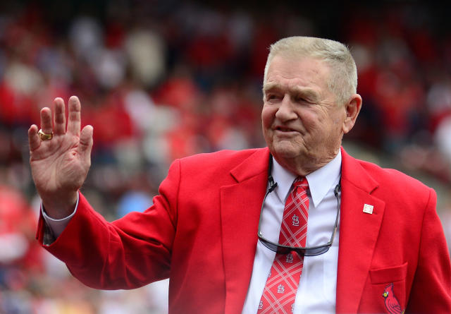 Former St. Louis Cardinals manager Whitey Herzog and wife Mary Lou wave to  friends during a parade up Main Street in Cooperstown, New York on July 24,  2010. Herzog will be enshrined