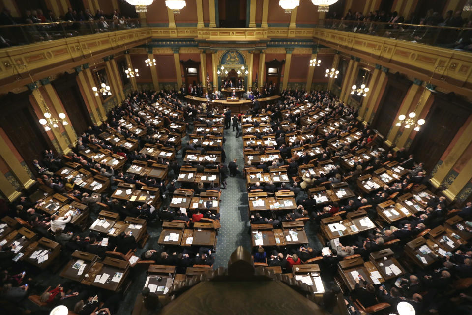 FILE- In this Jan. 16, 2013 file photo, Michigan Gov. Rick Snyder delivers his third annual State of the State address to a joint session of the state Legislature in the Capitol in Lansing, Mich. The city of Detroit reached tentative agreements to preserve pensions for retired police office and firefighters but cut monthly payments for other former employees, officials said Tuesday, April 15, 2014. (AP Photo/Carlos Osorio, File)