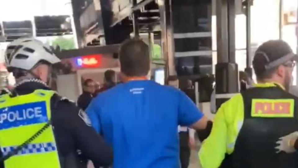 William Bay during a protest outside of AHPRA's Brisbane office, where he was subsequently arrested by police and charged with contravening a direction. Picture: Supplied / Twitter