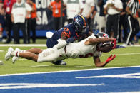 Western Kentucky wide receiver Mitchell Tinsley (5) dives past UTSA cornerback Mitchell Tinsley (3) after making a catch just short of the goal line during the second half of an NCAA college football game in the Conference USA Championship, Friday, Dec. 3, 2021, in San Antonio. (AP Photo/Eric Gay)