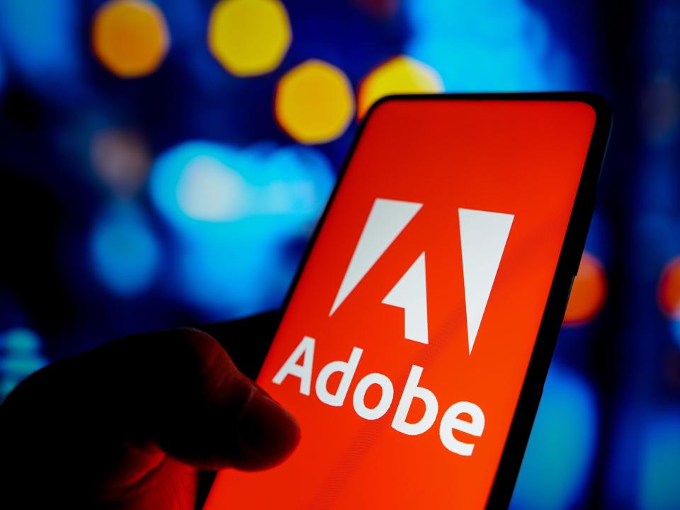 In this photo illustration, the Adobe Inc. logo seen displayed on a smartphone screen.