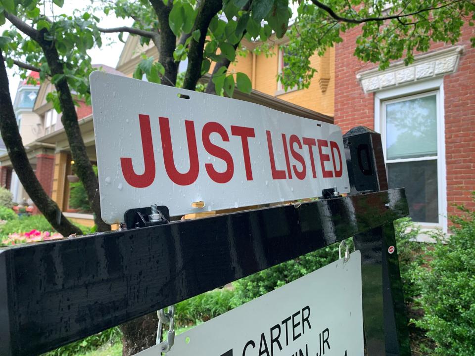 A "For Sale" sign in front of a home in Louisville's Highlands neighborhood in May 2021.