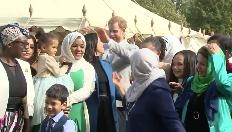 Prince Harry made sure Meghan Markle didn’t have a hair out of place, quite literally, at her cookbook launch. Source: Instagram/Harry Meghan Updates