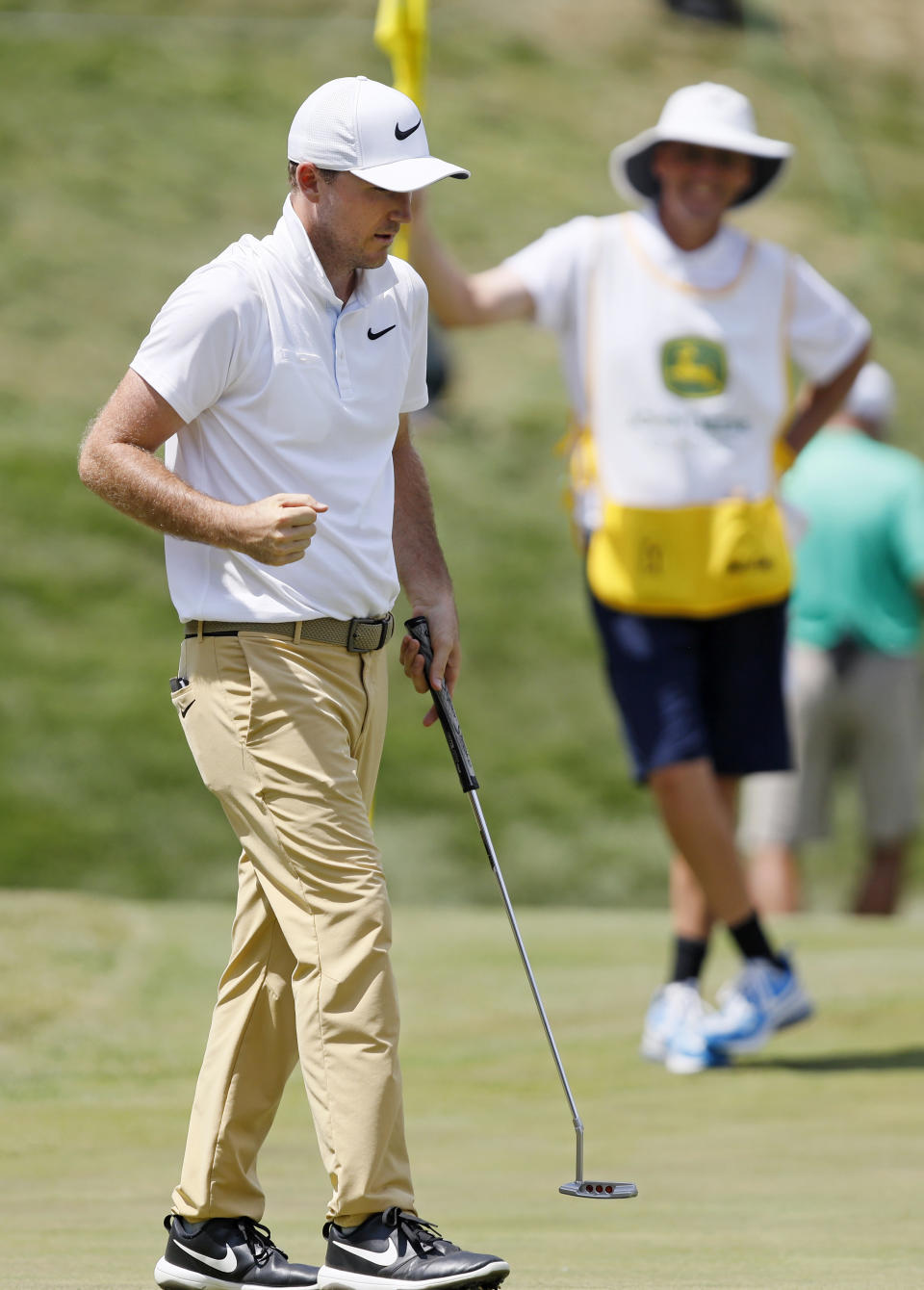 Russell Henley pumps his fist after making his birdie putt on the 18th green during the final round of the John Deere Classic golf tournament, Sunday, July 14, 2019, at TPC Deere Run in Silvis, Ill. (AP Photo/Charlie Neibergall)