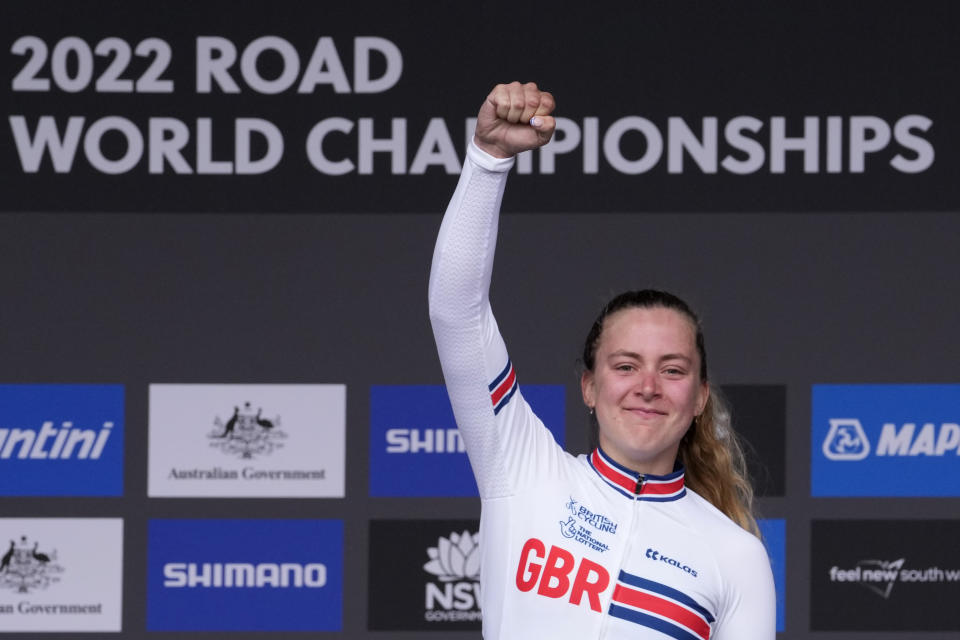 Britain's Zoe Backstedt celebrates winning the junior women's road race at the world road cycling championships in Wollongong, Australia, Saturday, Sept. 24, 2022. (AP Photo/Rick Rycroft)