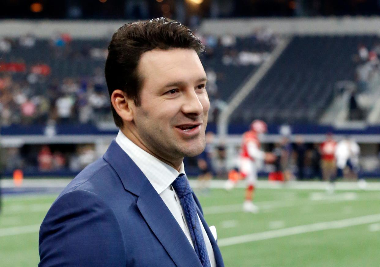 CBS football analyst Tony Romo walks across the field during warmups in Arlington, Texas, in 2017.