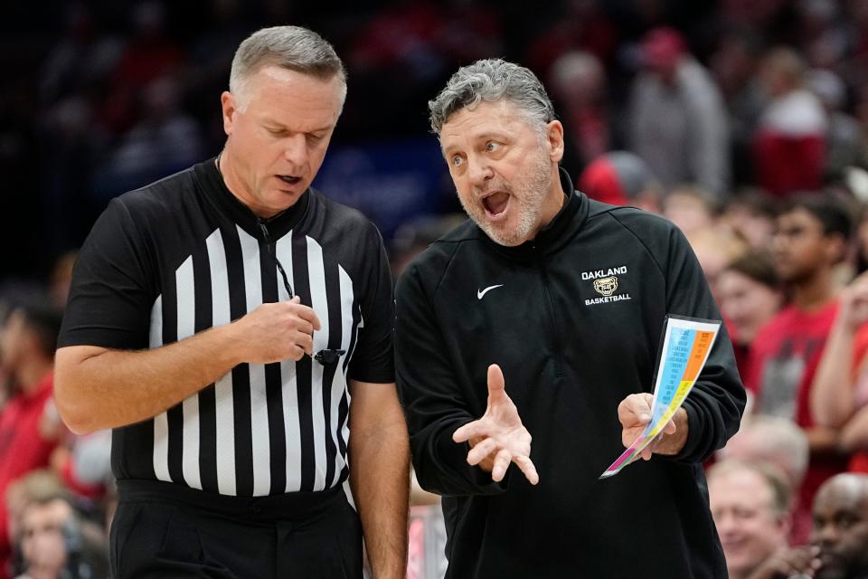 Nov 6, 2023; Columbus, OH, USA; Oakland Golden Grizzlies head coach Greg Kampe talks to an official during the NCAA men’s basketball game against the Ohio State Buckeyes at Value City Arena.