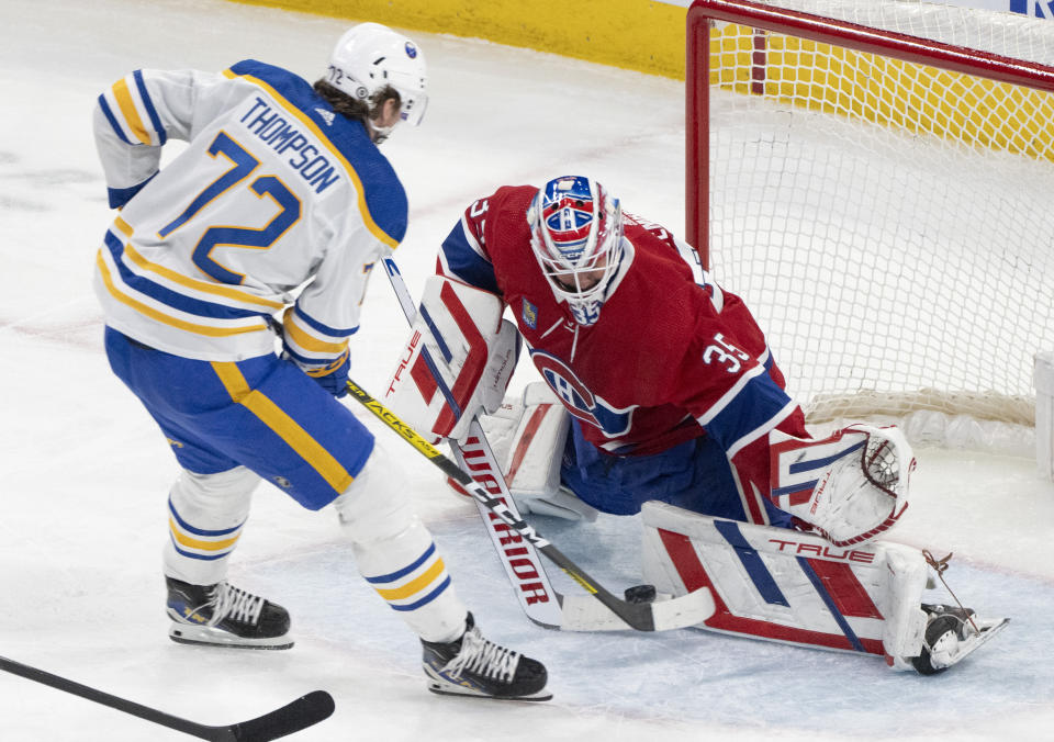 Montreal Canadiens goaltender Sam Montembeault (35) makes a save against Buffalo Sabres' Tage Thompson (72) during the first period of an NHL hockey game Wednesday, Feb. 21, 2024 in Montreal. (Christinne Muschi/The Canadian Press via AP)