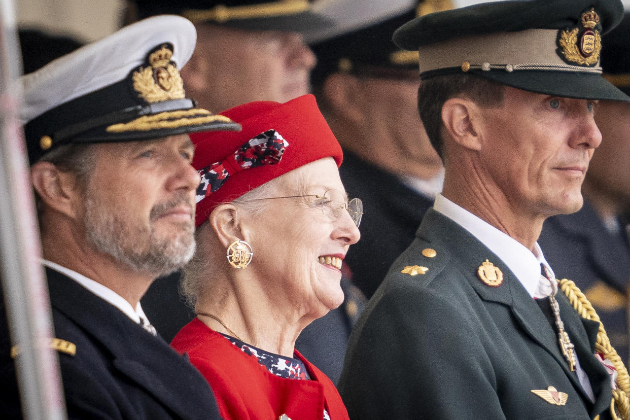 Queen Margrethe II of Denmark (C) is flanked by her sons Crown Prince Frederik of Denmark (L) and Prince Joachim of Denmark (R) as she attends festivities of the Danish Army to celebrate her 50th regency jubilee marked with a parade at the Naval Station in Korsoer, Denmark, on August 29, 2022. - Denmark OUT (Photo by Mads Claus Rasmussen / Ritzau Scanpix / AFP) / Denmark OUT (Photo by MADS CLAUS RASMUSSEN/Ritzau Scanpix/AFP via Getty Images)