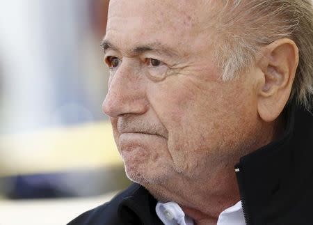 FIFA President Sepp Blatter reacts before the first game of the so-called "Sepp Blatter tournament" in Blatter's home-town Ulrichen, Switzerland, August 22, 2015. REUTERS/Denis Balibouse