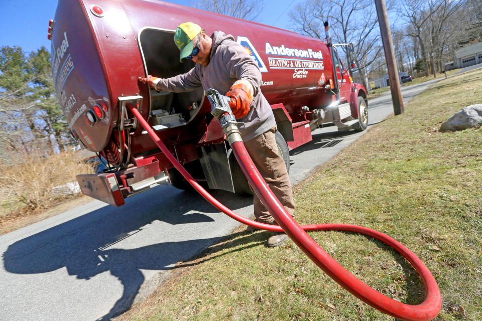 SCITUATE, MA - March 8:  Corey Carlson of Anderson Fuel after filling a house with home heating oil which has risen to over $5.00 a gallon on March 8, 2022 in Scituate, Massachusetts.  (Photo by Matt Stone/MediaNews Group/Boston Herald via Getty Images)