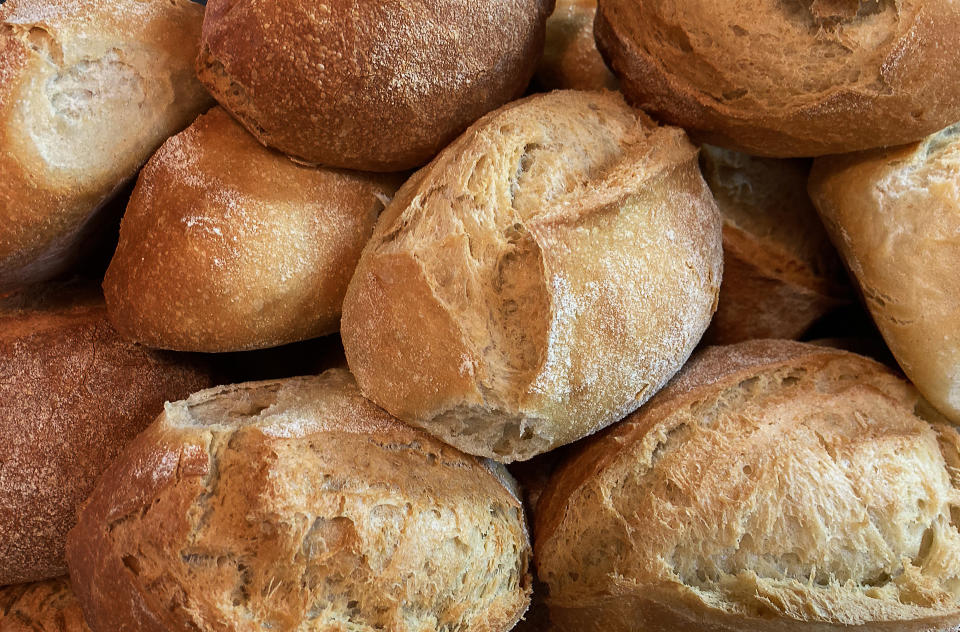 A stack of crusty Italian bread rolls