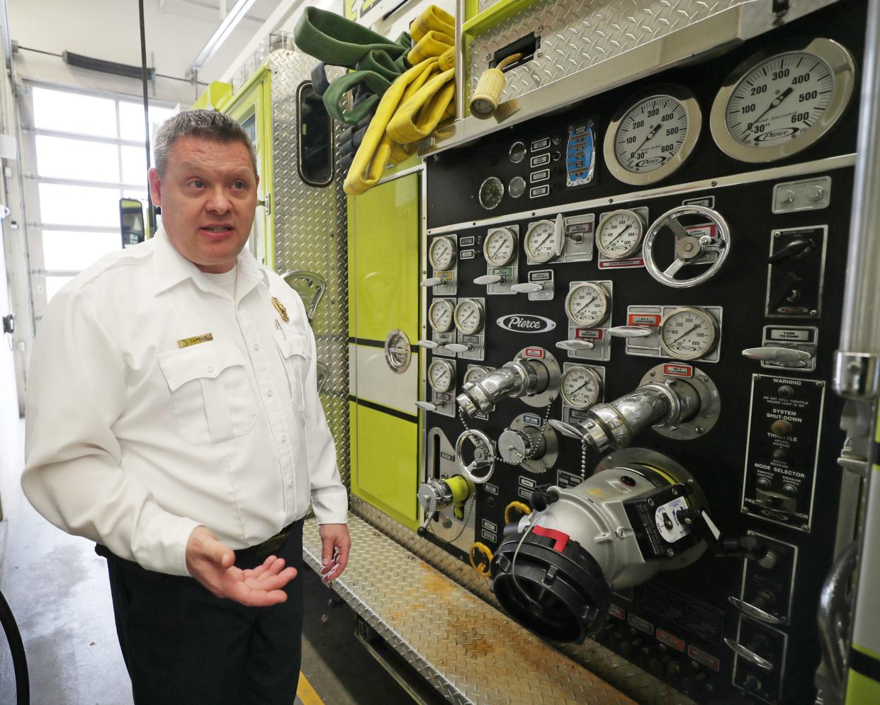 New Kent Fire Chief James Samels talks about the oldest piece of equipment in his department, Ladder Truck 1, while giving a tour of Station 1 on Tuesday, Feb. 27, 2024.