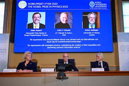 <span class="caption">Members of the Nobel Committee for Physics announce the winners of the 2022 Nobel Prize in Physics (L-R on the screen) Alain Aspect, John F. Clauser and Anton Zeilinger</span> <span class="attribution"><a class="link " href="https://www.alamy.com/secretary-general-of-the-royal-swedish-academy-of-sciences-hans-ellegren-c-eva-olsson-l-and-thors-hans-hansson-r-members-of-the-nobel-committee-for-physics-announce-the-winners-of-the-2022-nobel-prize-in-physics-l-r-on-the-screen-alain-aspect-john-f-clauser-and-anton-zeilinger-during-a-press-conference-at-the-royal-swedish-academy-of-sciences-in-stockholm-sweden-on-october-4-2022photo-jonas-ekstromer-tt-code-10030-image484884852.html?imageid=AD349CFE-58DF-4ECA-8C06-D7FFAB83D939&p=0&pn=1&searchId=eb5f38dd260158c9c72eaeb3929f9ed1&searchtype=0" rel="nofollow noopener" target="_blank" data-ylk="slk:TT News Agency / Alamy Stock Photo;elm:context_link;itc:0;sec:content-canvas">TT News Agency / Alamy Stock Photo</a></span>