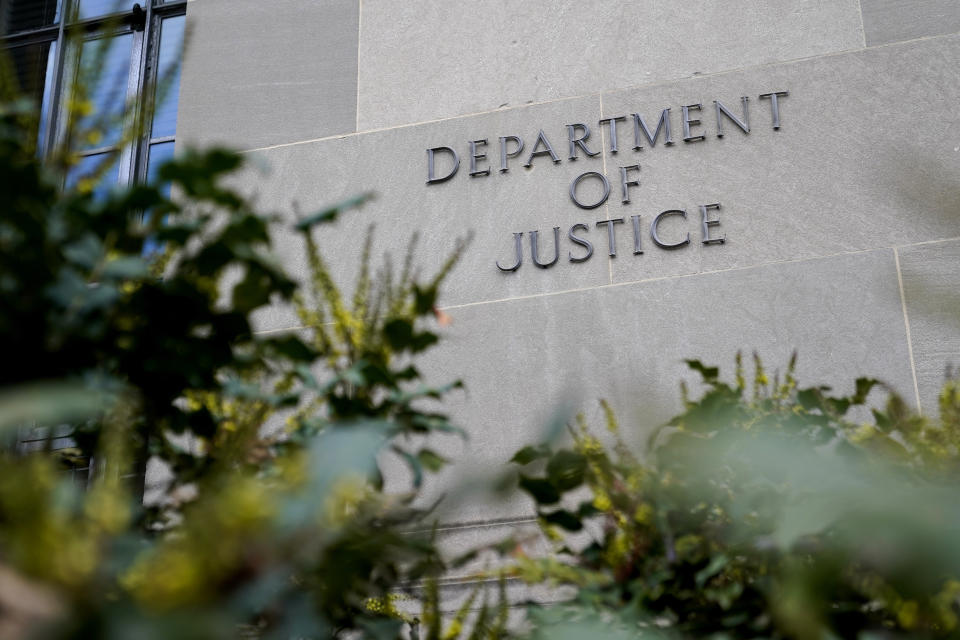 FILE - A sign marks an entrance to the Robert F. Kennedy Department of Justice Building in Washington, Monday, Jan. 23, 2023. The Justice Department has been scrutinizing a controversial artificial intelligence tool used by a Pittsburgh-area child protective services agency following concerns that it could result in discrimination against families with disabilities, The Associated Press has learned. (AP Photo/Patrick Semansky, File)