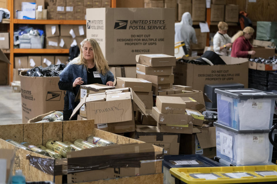 Volunteers with Razom for Ukraine, a New York-based nonprofit, pack firefighting and medical donations for shipment to Ukraine, Wednesday, Feb. 8, 2023, in Woodbridge Township, N.J. (AP Photo/John Minchillo)