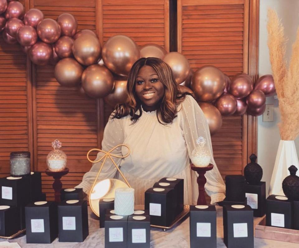 Janica Pierre, the owner of Janica Marcelle Collection luxury candle brand, seen here on April 17, 2021, is one of the vendors at Black Owned Brockton's Holiday Market, which kicked off at Westgate Mall on Nov. 19, 2021.