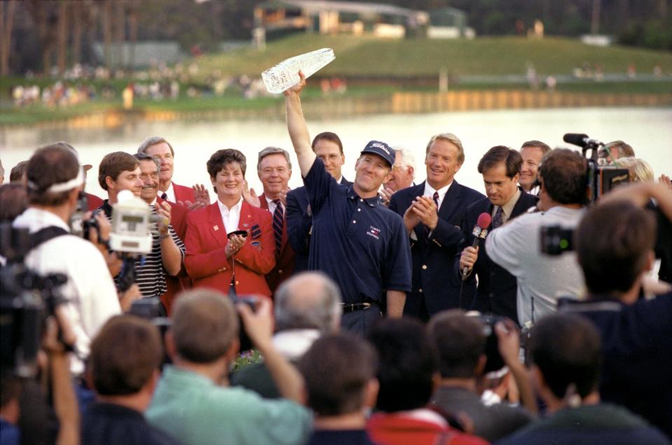 David Duval displays the trophy for winning the 1999 Players Championship.