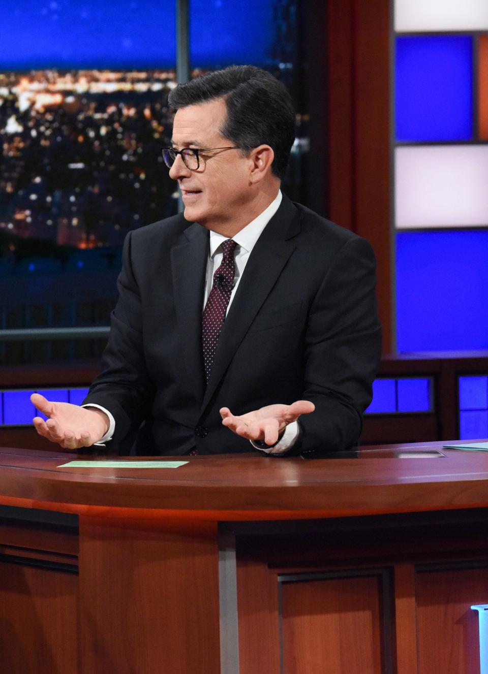 Stephen on his show sitting behind his desk