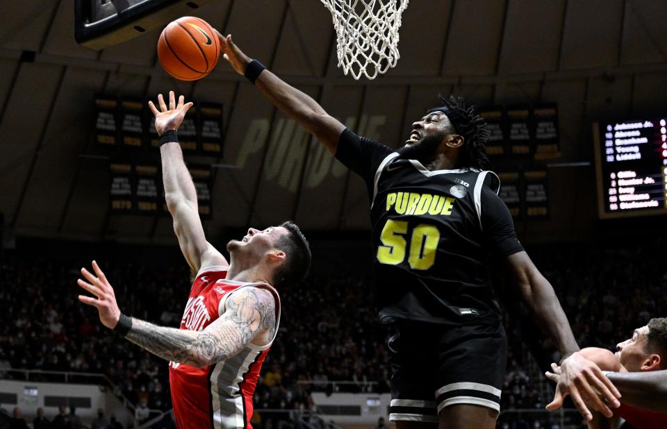 Jan 30, 2022; West Lafayette, Indiana, USA; Purdue Boilermakers forward Trevion Williams (50) blocks a shot by Ohio State Buckeyes forward Kyle Young (25) during the first half at Mackey Arena. Mandatory Credit: Marc Lebryk-USA TODAY Sports
