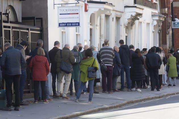 People lined up outside a vaccination center in London to receive a COVID-19 vaccine or booster shot on Thursday. COVID-19 cases have been rising in the U.K. since early September. (Photo: Anadolu Agency via Getty Images)
