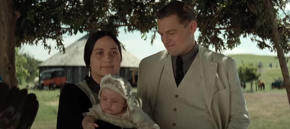 Mollie Burkhart holding a baby and Ernest Burkhart in "Killers of the Flower Moon."