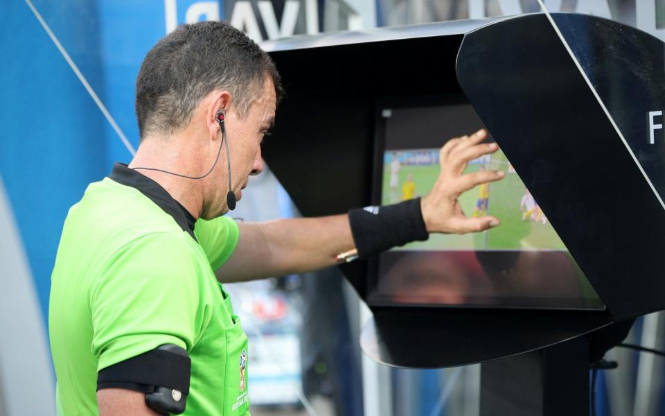 Joel Aguilar reviews the VAR footage, before awarding Sweden a penalty - FIFA