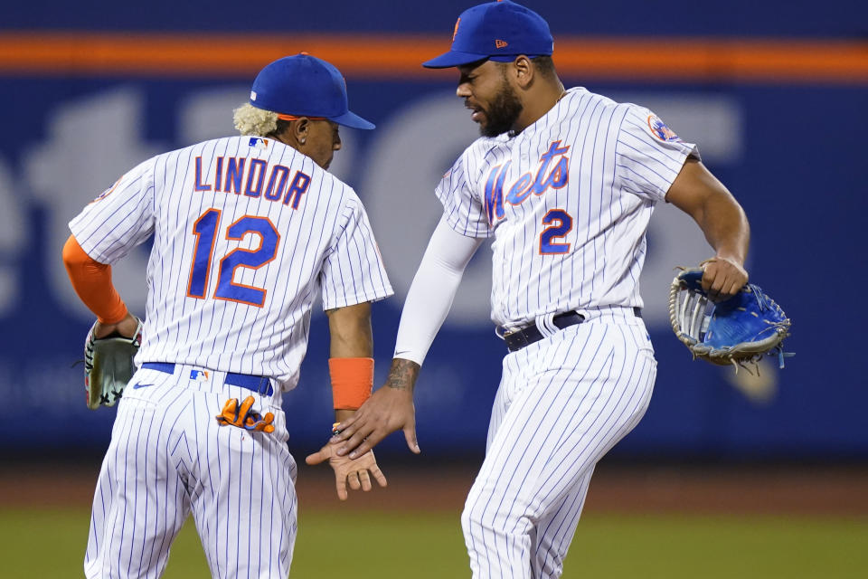 New York Mets' Francisco Lindor (12) celebrates with Dominic Smith after the team's baseball game against the Chicago Cubs on Tuesday, June 15, 2021, in New York. The Mets won 3-2. (AP Photo/Frank Franklin II)