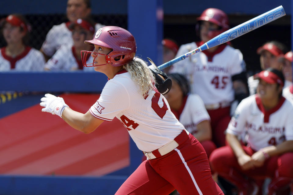 Oklahoma's Jayda Coleman follows through after hitting a home run against Stanford during the third inning of an NCAA softball Women's College World Series game Monday, June 5, 2023, in Oklahoma City. (AP Photo/Nate Billings)