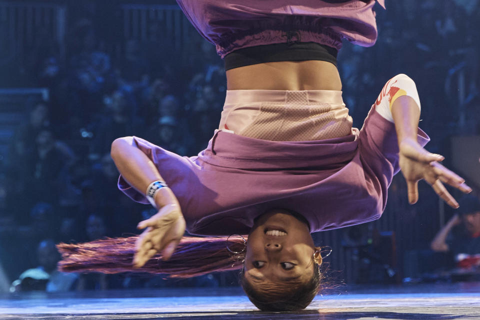 Logan Edra, also known as B-Girl Logistx, from United States competes in the B-girl Red Bull BC One World Final at Hammerstein Ballroom on Saturday, Nov. 12, 2022, in Manhattan, New York. The International Olympic Committee announced two years ago that breaking would become an official Olympic sport, a development that divided the breaking community between those excited for the larger platform and those concerned about the art form’s purity. (AP Photo/Andres Kudacki)