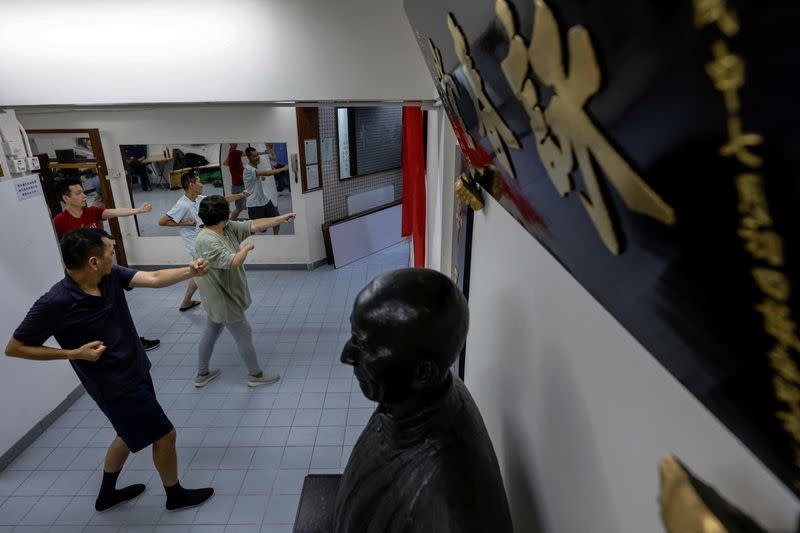 The Wider Image: Fifty years on, Bruce Lee's legacy squares up to modern life in Hong Kong