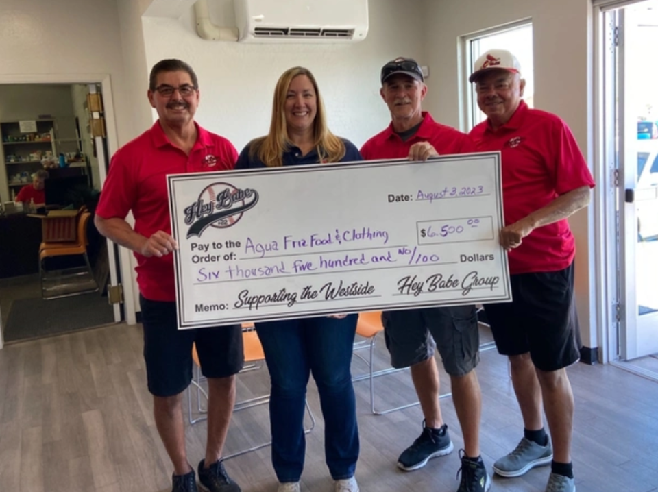 Members of the Hey Babe nonprofit present a check to the Agua Fria Food & Clothing Bank. The nonprofit recently received its first-ever grant from the Local Causes program set up by Arizona Financial Credit Union.