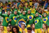 <p>Brazilian supporters attend the women’s preliminaries Group A handball match Norway vs Brazil on Day 1 of the Rio 2016 Olympic Games at Future Arena on August 6, 2016 in Rio de Janeiro, Brazil. (Photo by Pascal Le Segretain/Getty Images) </p>