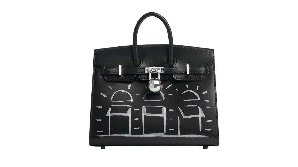 a black handbag with a white background