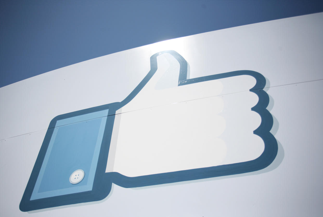 A Facebook Like Button logo is seen at the entrance of the Facebook headquarters in Menlo Park on May 10, 2012 in California.    AFP PHOTO / Kimihiro HOSHINO        (Photo credit should read KIMIHIRO HOSHINO/AFP/GettyImages)