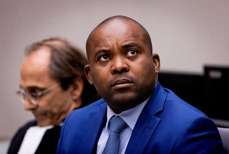 FILE PHOTO: Aime Kilolo Musamba of the Democratic Republic of the Congo sits in the courtroom of the International Criminal Court (ICC) during the Delivery of decision on sentencing in Bemba et al. case in the Hague, Netherlands March 22, 2017. REUTERS/Robin van Lonkhuijsen/Pool/File Photo