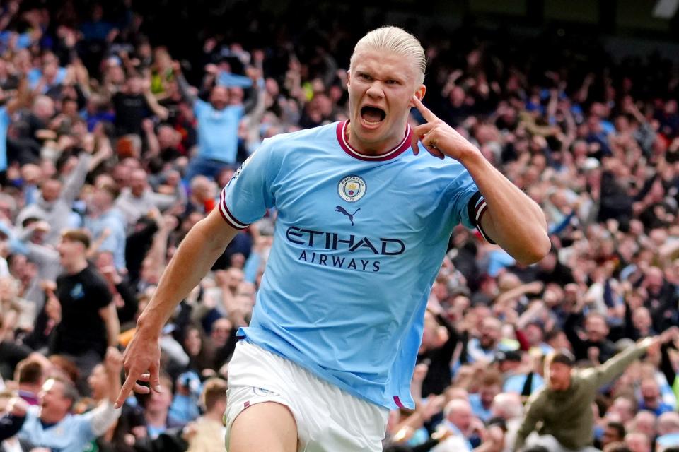 Erling Haaland of Manchester City celebrates their sides third goal during the Premier League match between Manchester City and Manchester United at Etihad Stadium on October 02, 2022 in Manchester, England.