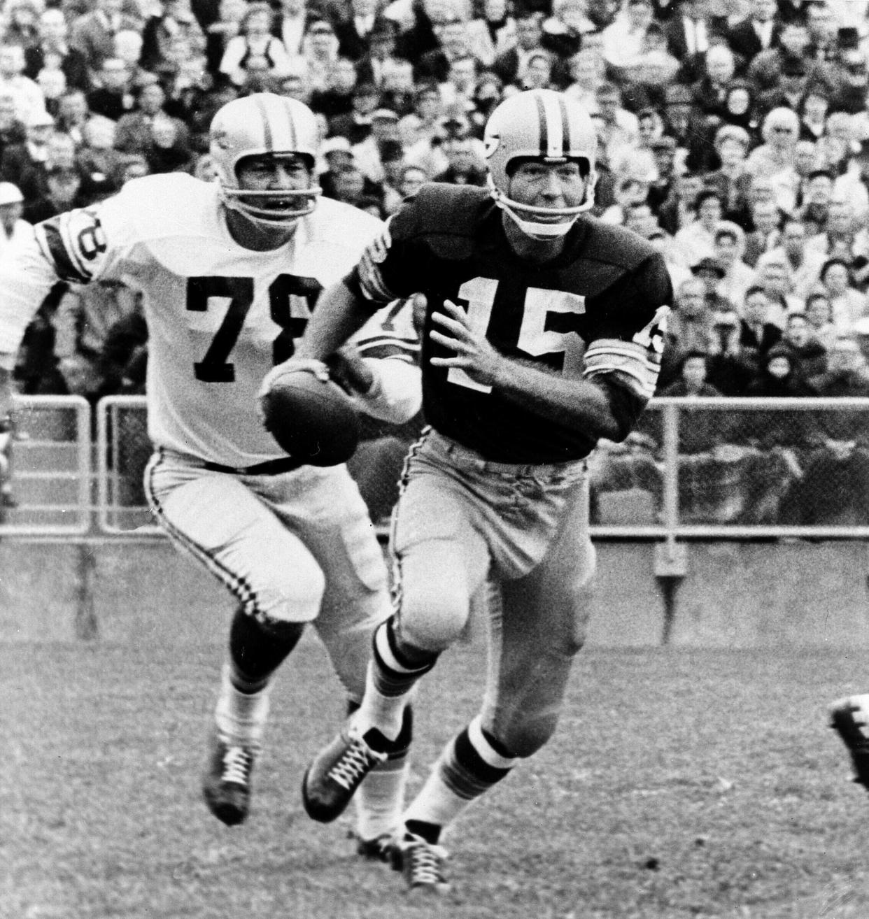 Green Bay Packers quarterback Bart Starr is pursued by Detroit Lions defender Darris McCord during a 1966 game.