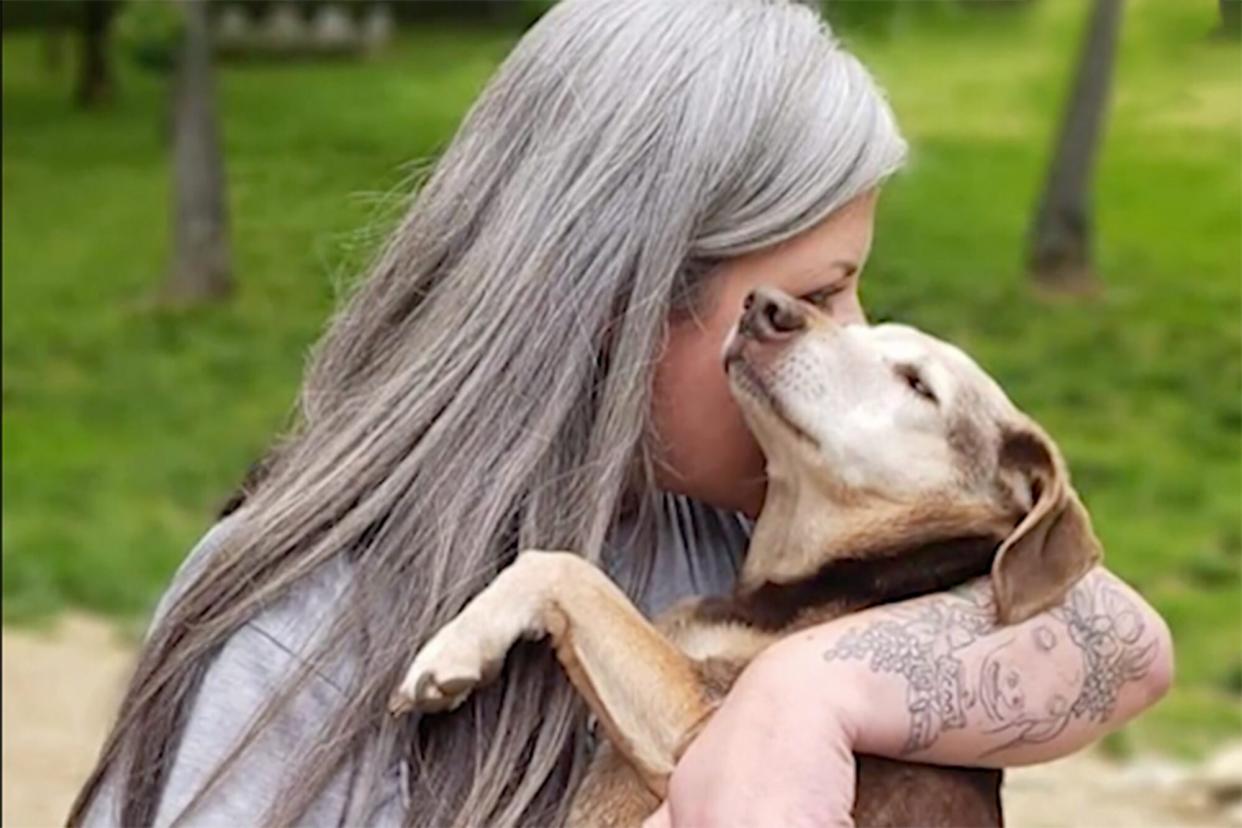 Valerie Reid with a dog from her senior dog sancutary Whispering Willows