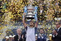 Casper Ruud of Norway lifts the trophy after defeating Stefanos Tsitsipas of Greece 7-5, 6-3 during the final of the Barcelona Open tennis tournament in Barcelona, Spain, Sunday, April 21, 2024. (AP Photo/Joan Monfort)