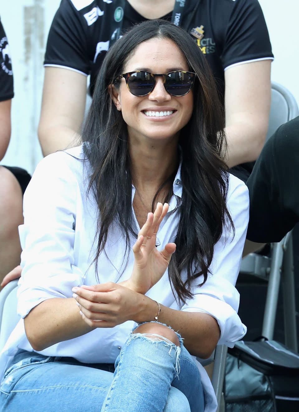 Be quick: Meghan's simple white shirt is still up for grabs. Photo: Getty