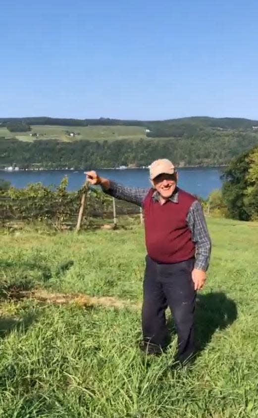 Mel Goldman, owner of Keuka Lake Vineyards, shares a laugh with a visitor touring his vineyard on Keuka Lake.