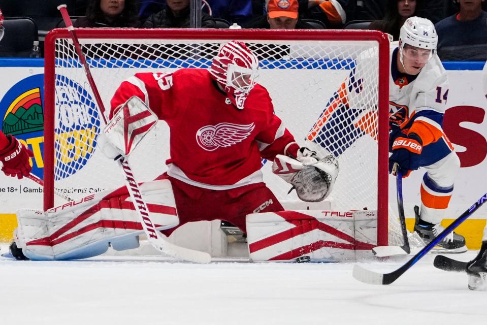 Red Wings goaltender Ville Husso stops a shot on goal by the Islanders' Bo Horvat during the first period on Monday, Oct. 30, 2023, in Elmont, New York.