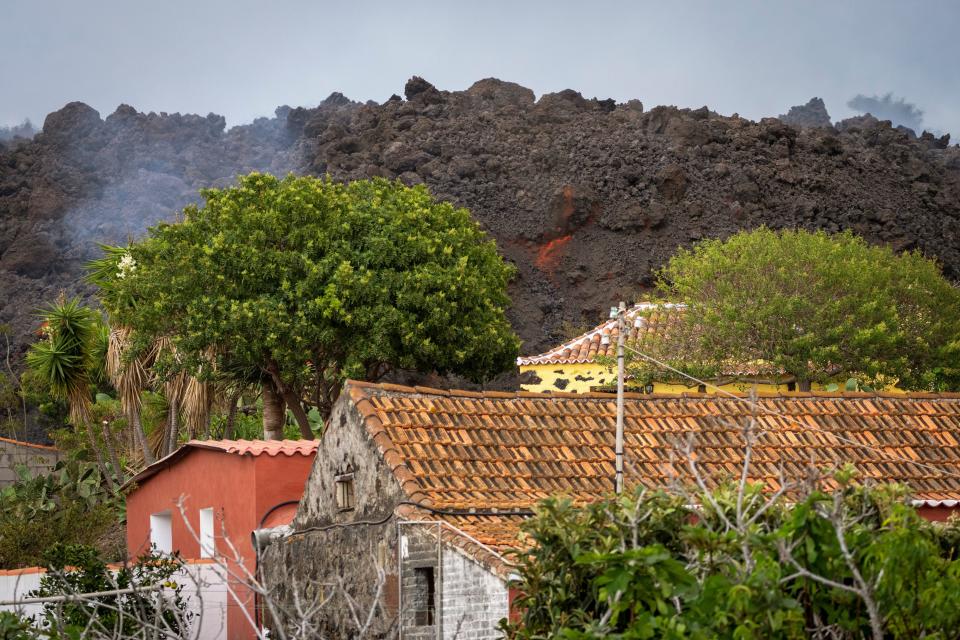 Lava from a volcano eruption flows on the island of La Palma in the Canaries, Spain, Wednesday, Sept. 22, 2021.
