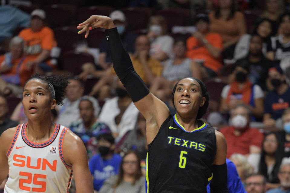 Dallas Wings forward Kayla Thornton knocks down a 3-pointer while Connecticut Sun forward Alyssa Thomas looks on during Game 2 of their first-round WNBA playoffs series on Aug. 21, 2022, at Mohegan Sun Arena in Uncasville, Connecticut. (Erica Denhoff/Icon Sportswire via Getty Images)