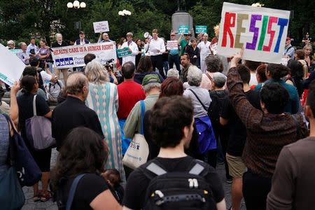 People attend a rally to support universal healthcare in the Manhattan borough of New York City, New York, U.S. July 24, 2017. REUTERS/Carlo Allegri -