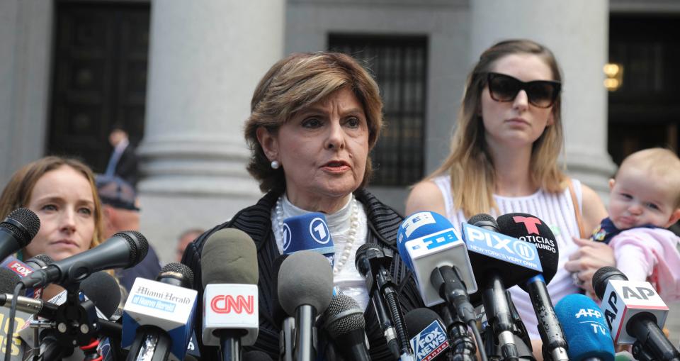 Attorney Gloria Allred, center, flanked by two clients who are Jeffrey Epstein accusers,  speaks during a news conference after leaving a Manhattan federal court where victims of the wealthy financier who died in jail addressed a hearing on whether the sex trafficking charges against Epstein should be dismissed.Tuesday Aug. 27, 2019 (AP Photo/Bebeto Matthews)